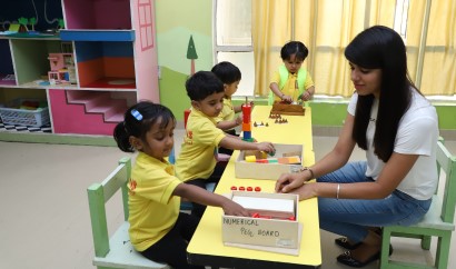 Children engaged in Montessori oriented activities like Pink Tower, Bead Counting, Puzzle Maps at Crayons Play School Ranchi